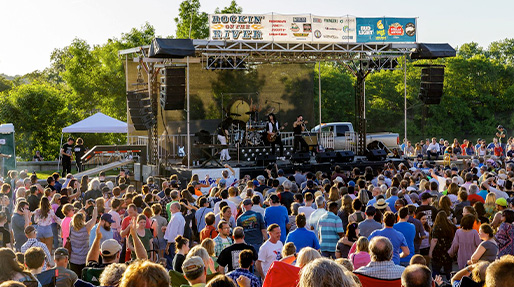 wide shot many fans crowding the stange for rockin on the river