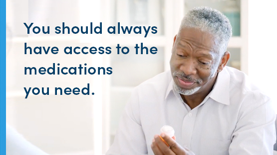 senior man looking at his prescription bottle