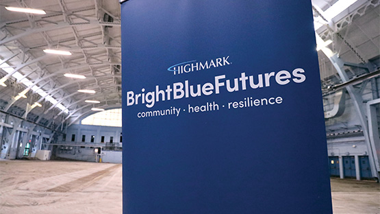 bright blue futures poster banner inside the hunt armory
