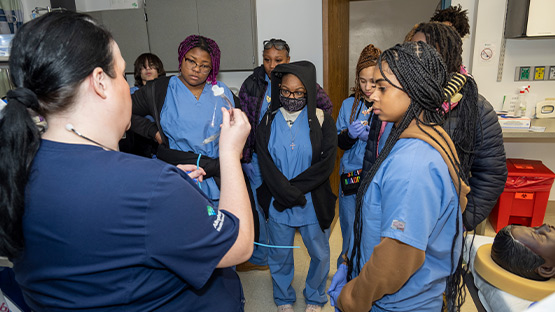 photo of a group of student training with medical assisted needs