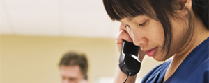 a doctor on the phone with a patient talking about health decisions