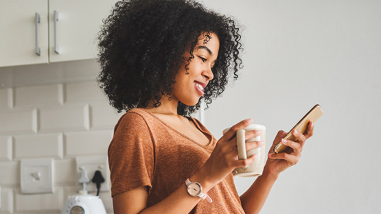young women on her mobile device looking to register on My Highmark