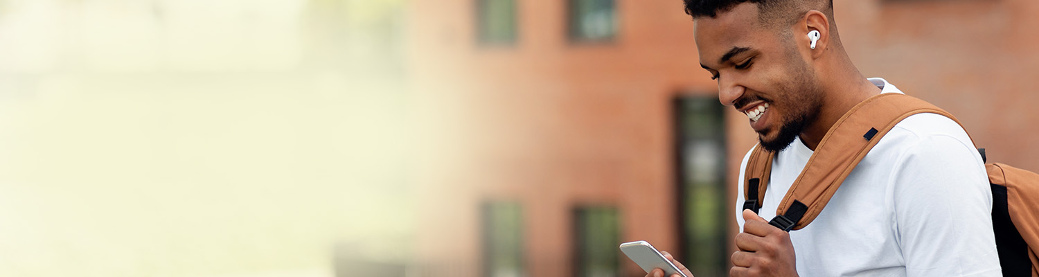 photo of a middle age man on his mobile device