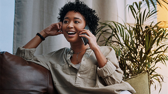 photo of a young female talking on her mobile device