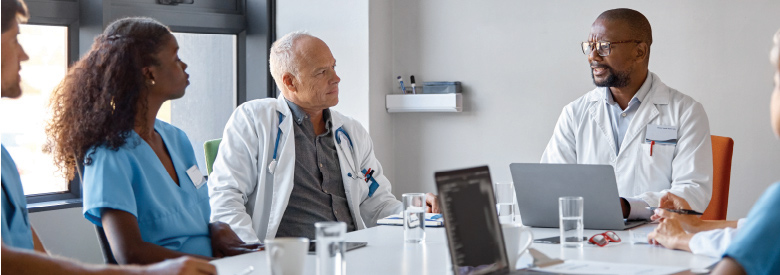 group of health professionals having a meeting around a table