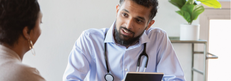 patient talking to a doctor in an office setting