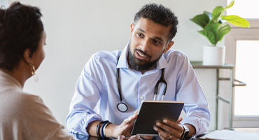 patient talking to a doctor in an office setting