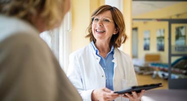 photo of a doctor talking to a patient