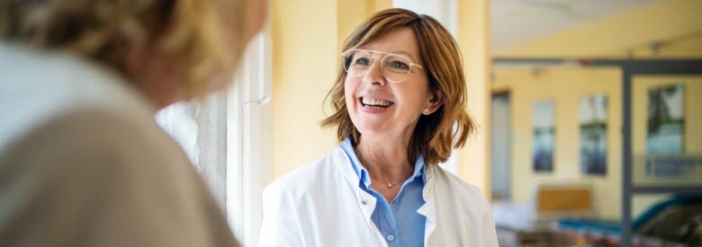 photo of a doctor talking to a patient