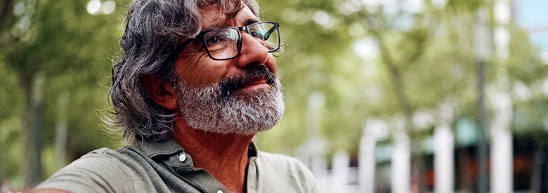 a middle age man in nature with a concerned look on his face