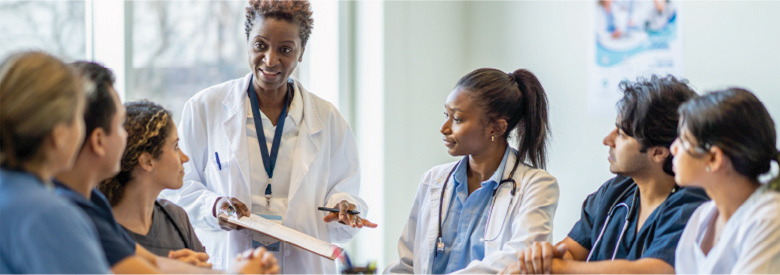 a group of doctors and nurses discussing a preventive care topic