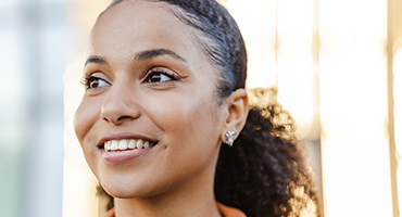smiling woman looking to the left