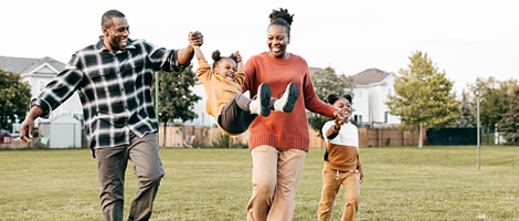 photo of a family of four having fun in their backyard