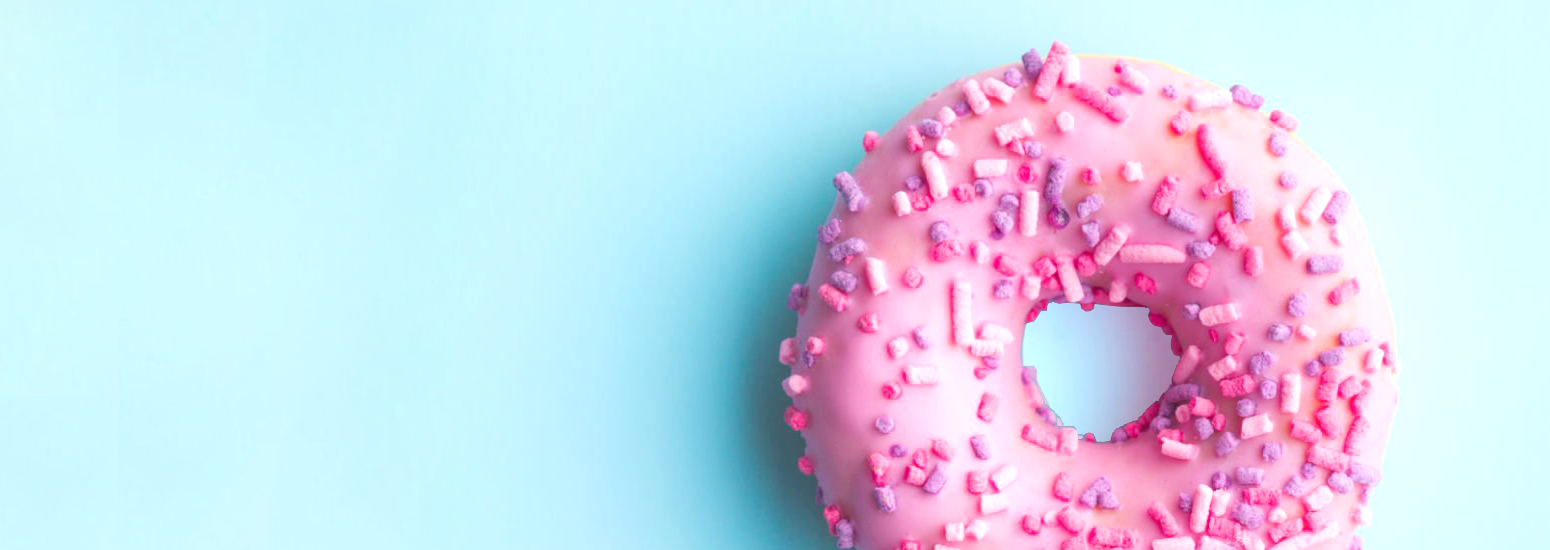 a pink donut with sprinkles