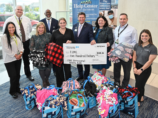 Highmark Blue Cross Blue Shield employees posing with 45 handmade blankets