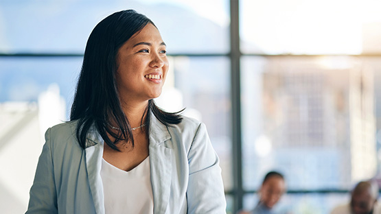 Aa smiling woman, excited about how Highmark Ventures is innovating health care. 