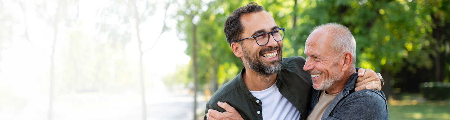 father and son hugging and laughing