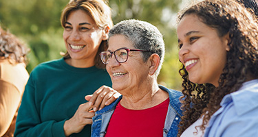 Smiling multi-generational people happily look forward, representing the positive options of Highmark D-SNP plans.