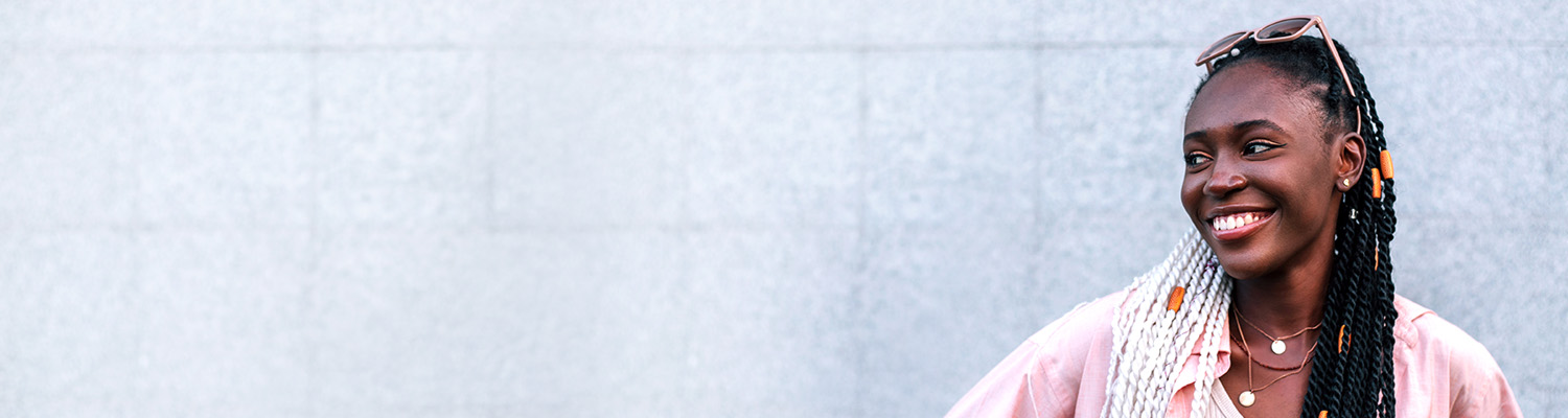 smiling woman standing outside