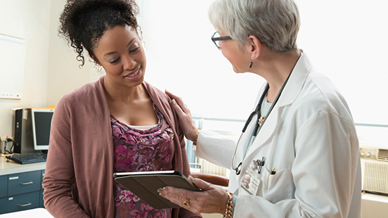 Pregnant woman with a doctor. 