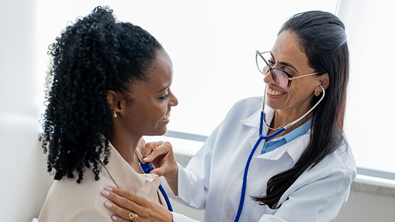 A woman is having a checkup with her doctor.