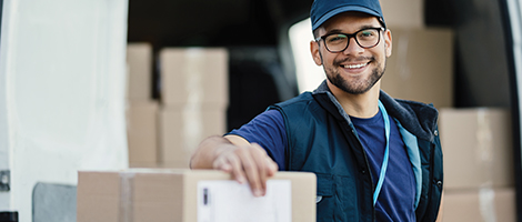 Warehouse worker moving boxes to a truck. 
