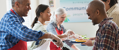 Members of the West Virginia Family Resource Network  are serving food to others in their community. 